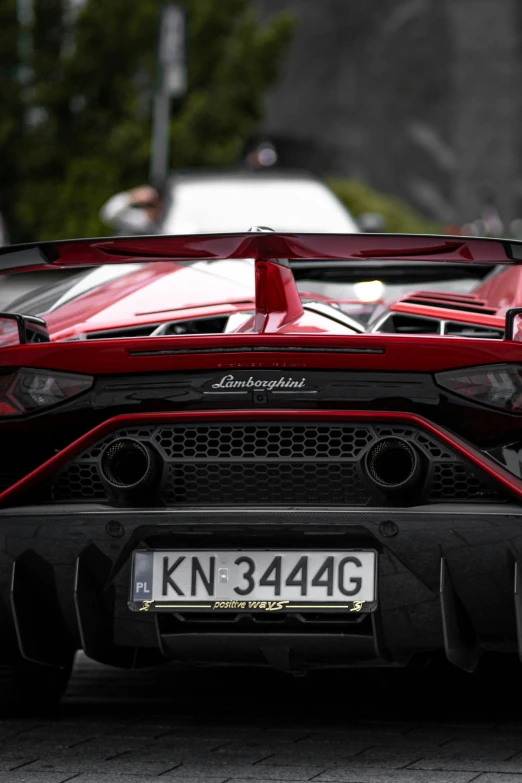 the front end of a red supercars sports car