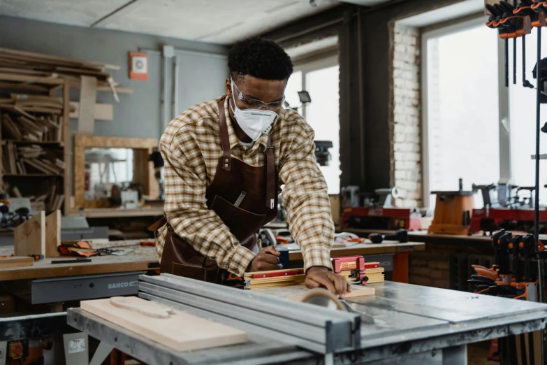 a person at work on soing on a machine