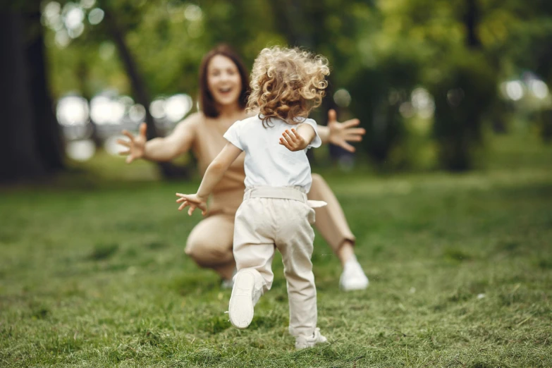 an adorable little child jumping into the air