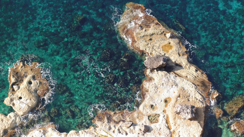 a large body of water surrounded by rocks