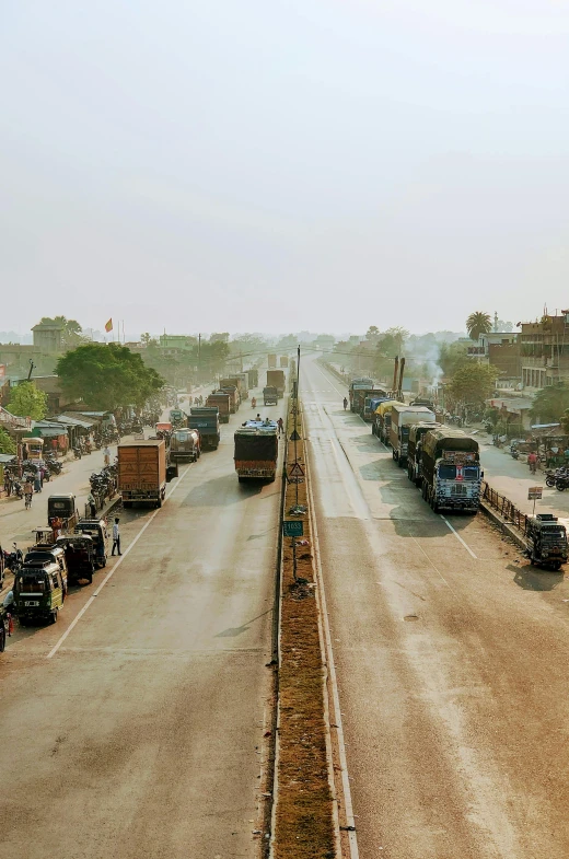 the truck is passing on the highway with other cars