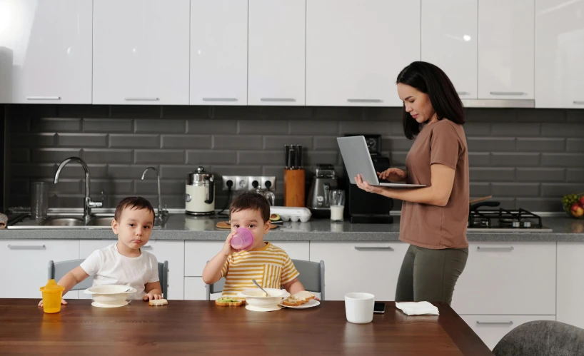 there is a woman with a plate that has three children on it