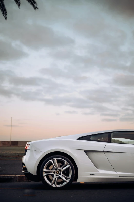 a white sports car parked on the road