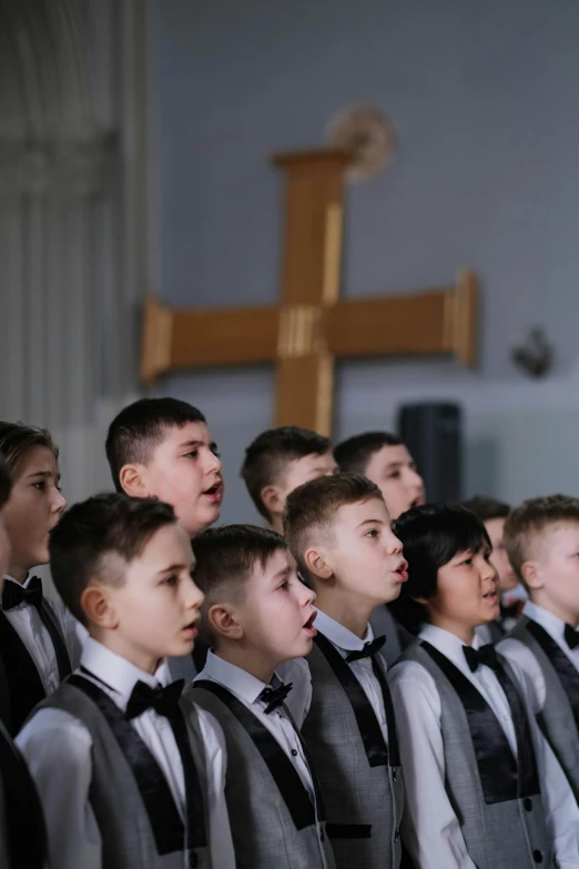 an choir looking on at the priest