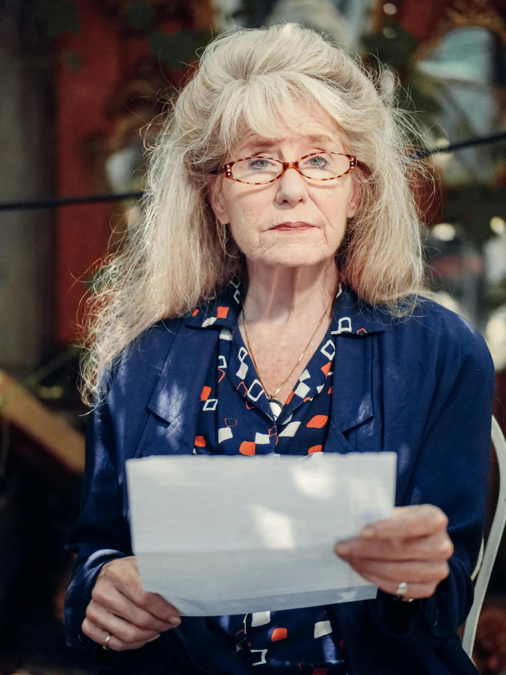 a woman looking sad while sitting down reading