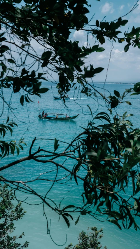 a boat traveling in the middle of the ocean