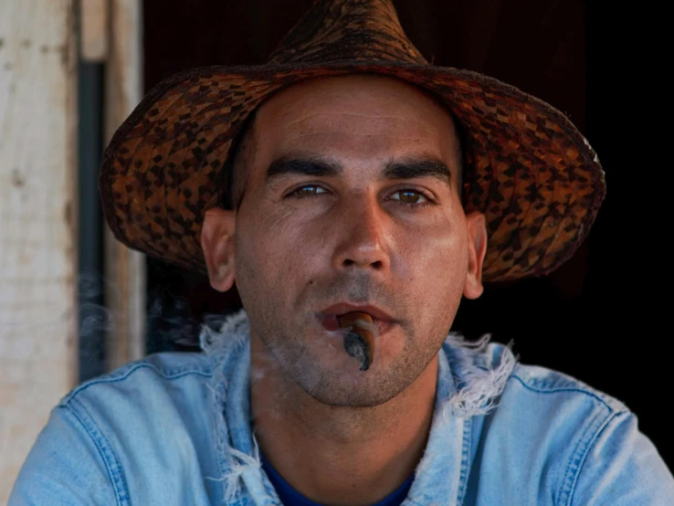 a close up of a person wearing a hat