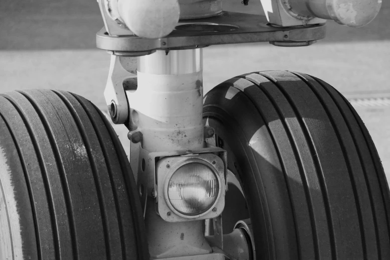 a close up of the front wheel and front tires of an airplane