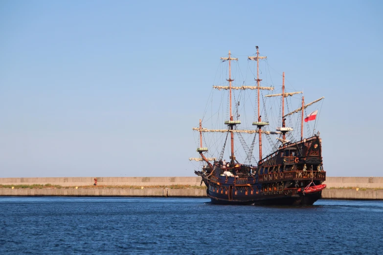 a tall ship sailing through the water