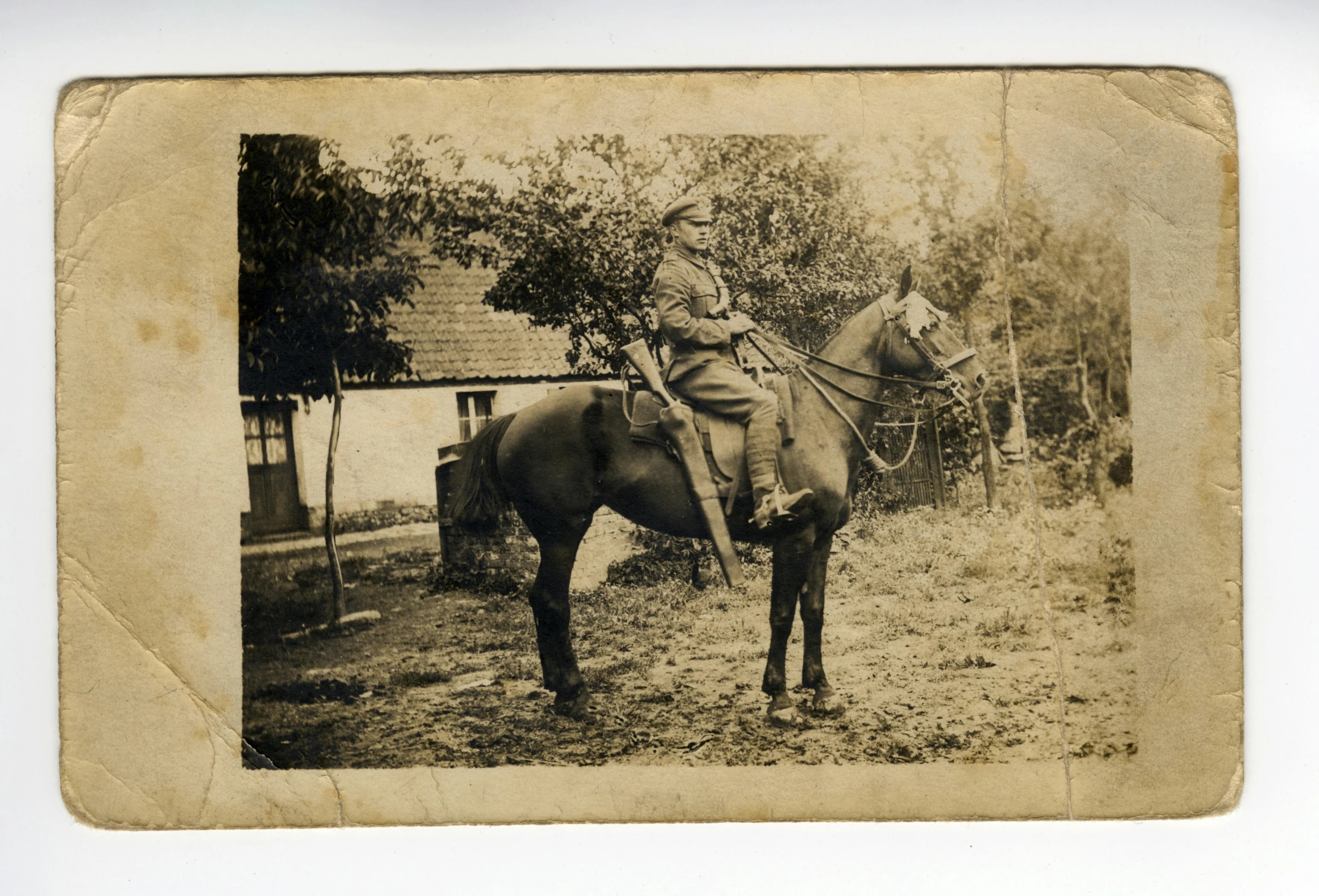 an old po of a woman sitting on a horse