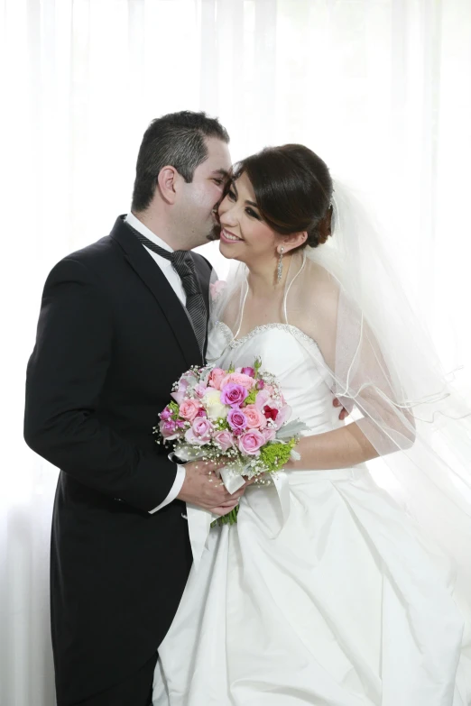 a couple of people in a wedding dress