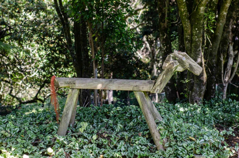 a wooden bench made to look like a horse