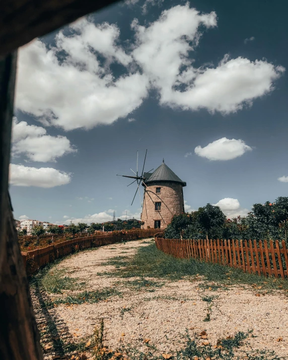 a windmill and fence are in the foreground, and there is no image on it