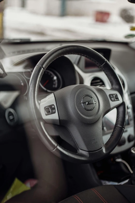 steering wheel and dash of a small car