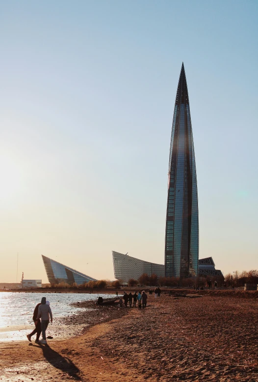 a beach with several different architectural structures on it