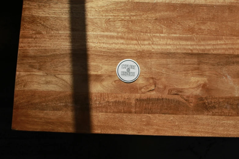 a wood slab with a clock sitting on it