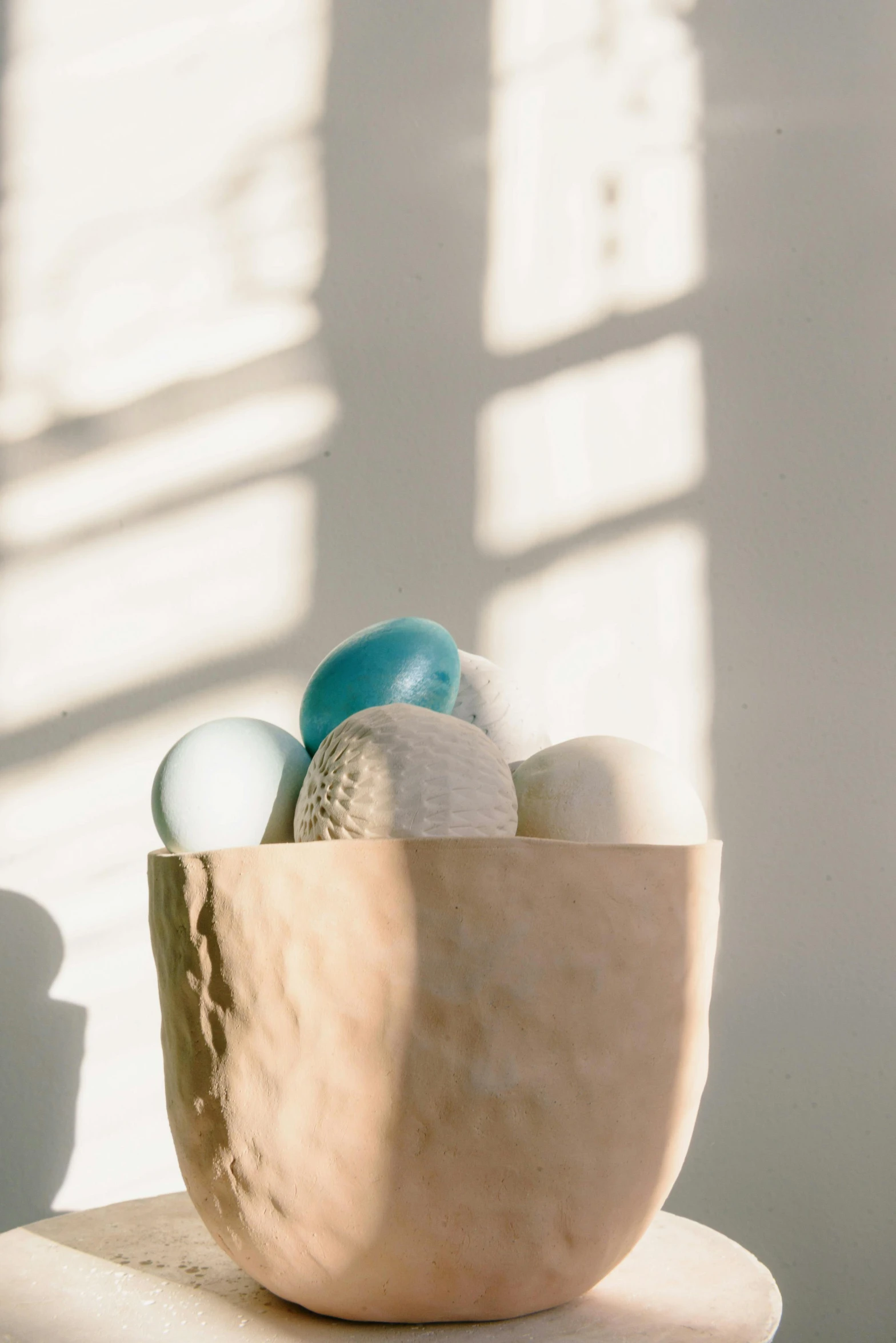 a small bowl of eggs on top of a table