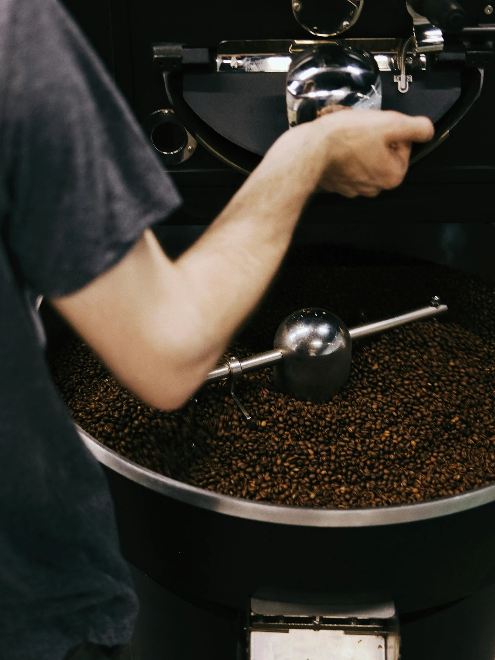 the person is preparing a coffee machine for the drink