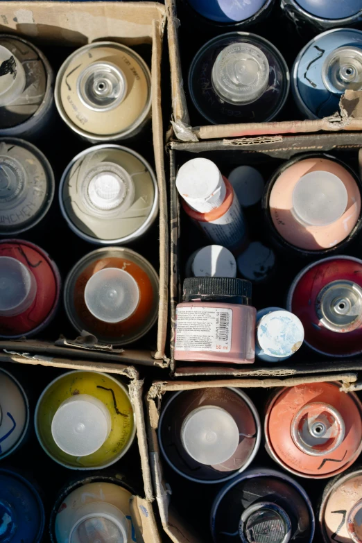 several boxes of paint are stacked up