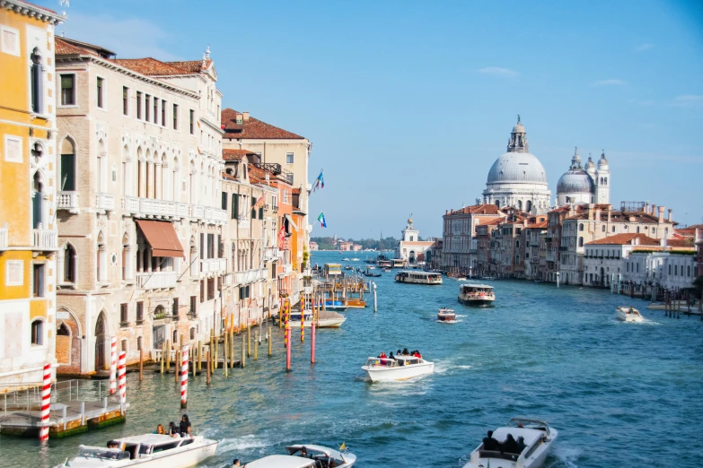 several boats are going down the canal in venice