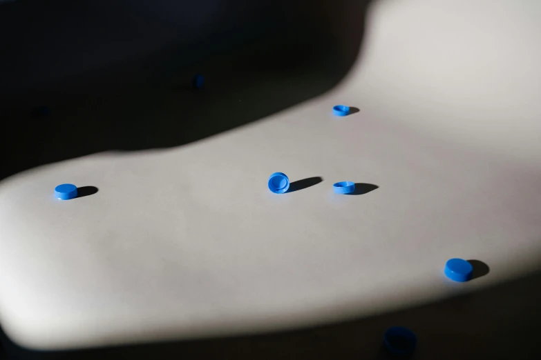 white couch with blue beads sitting on top