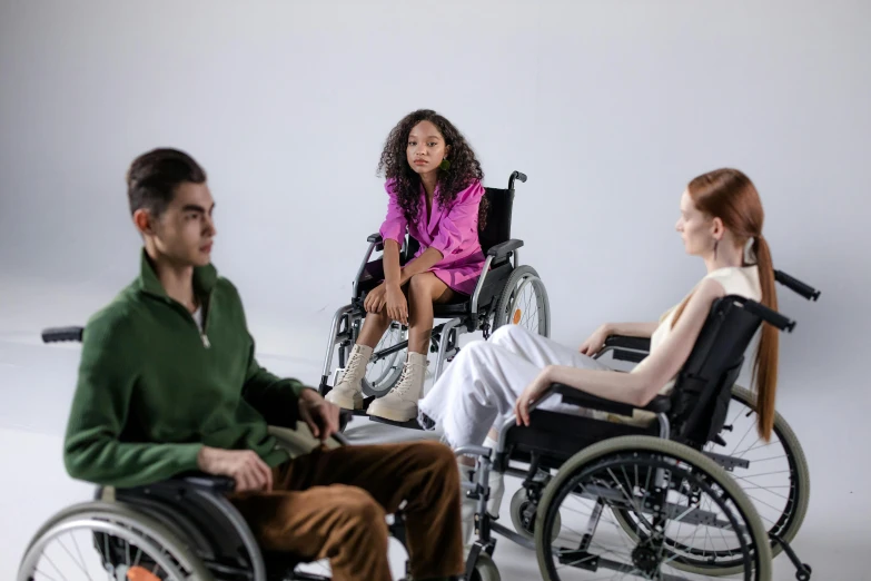 a group of people in wheelchairs sitting next to each other