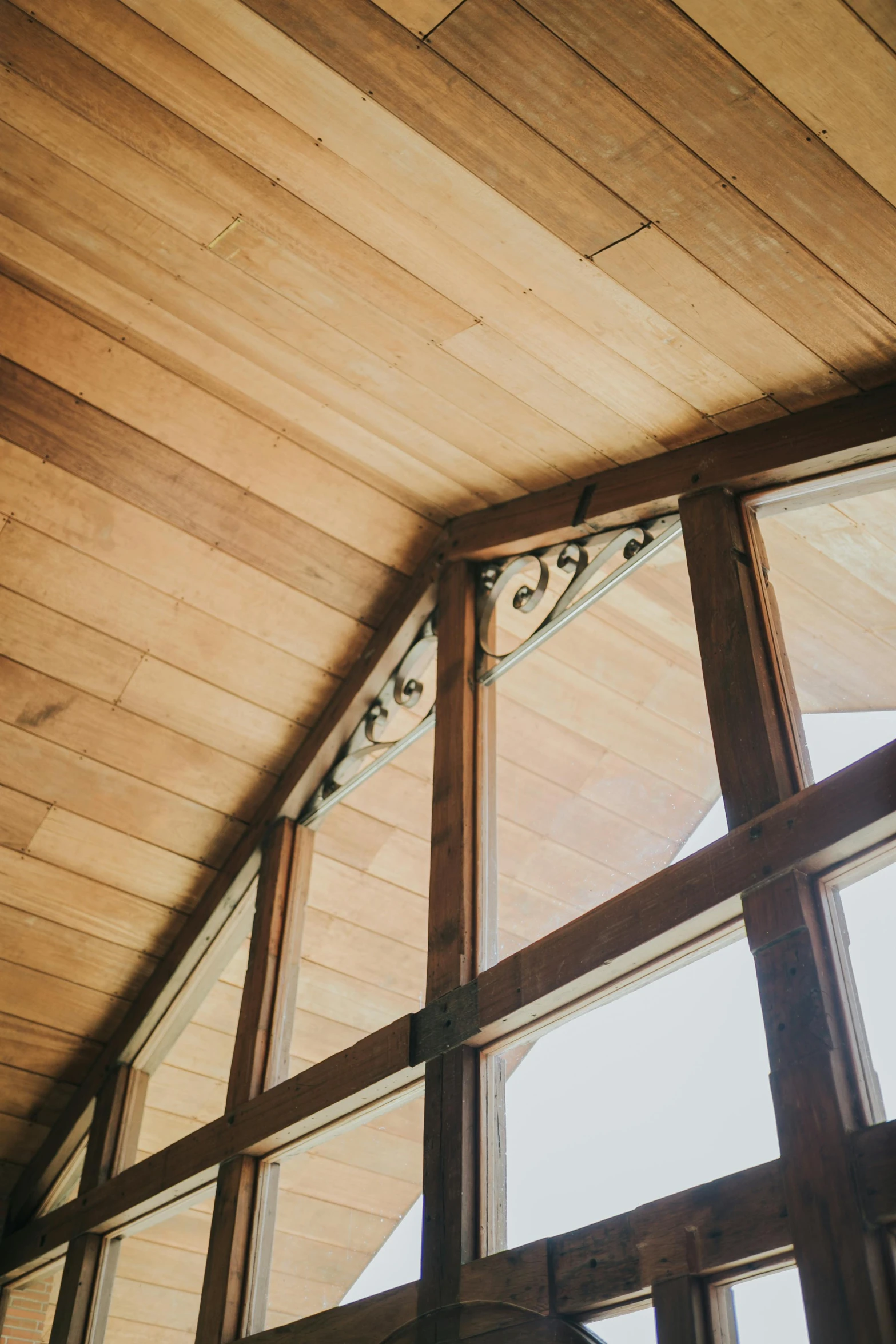 a room with a couple of windows and a ceiling