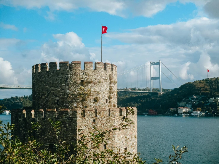 there is a tower of an old building by the water