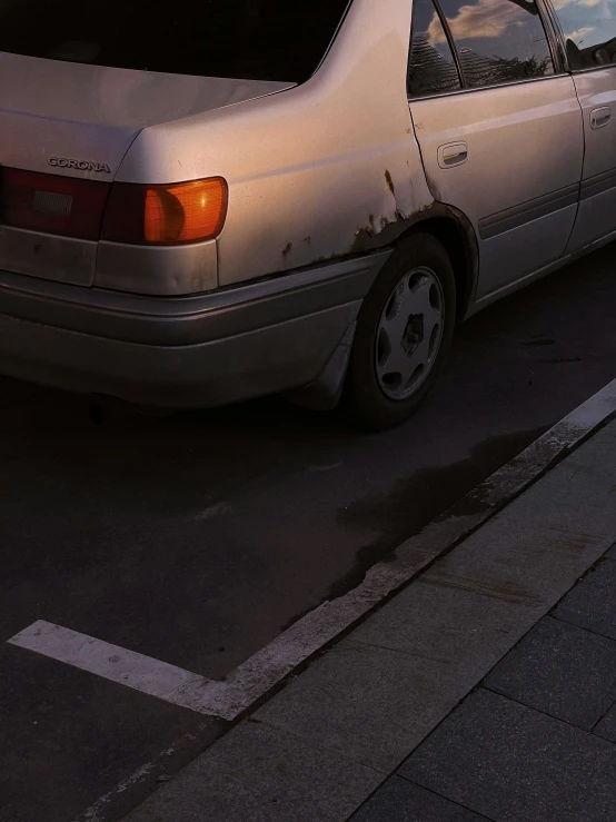 a white car parked on the side of the road