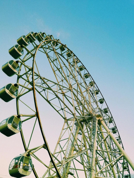 the roller coaster in front of a blue sky