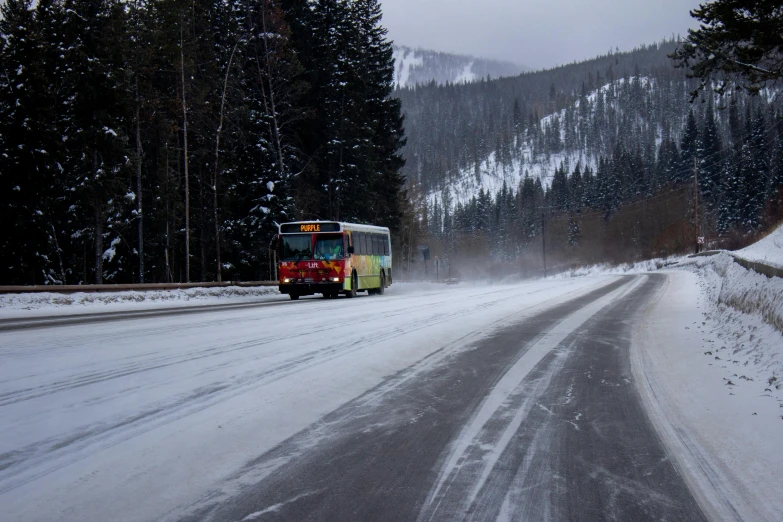 an ice covered road with a bus driving it