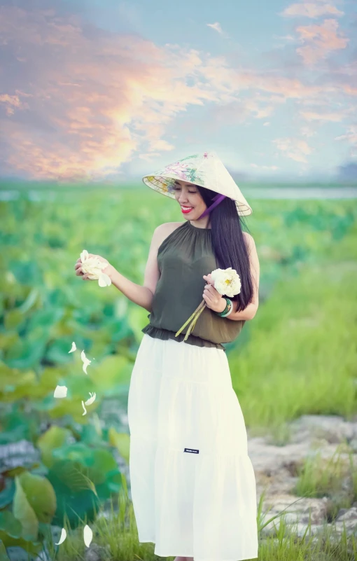 a woman with long hair holding some flowers