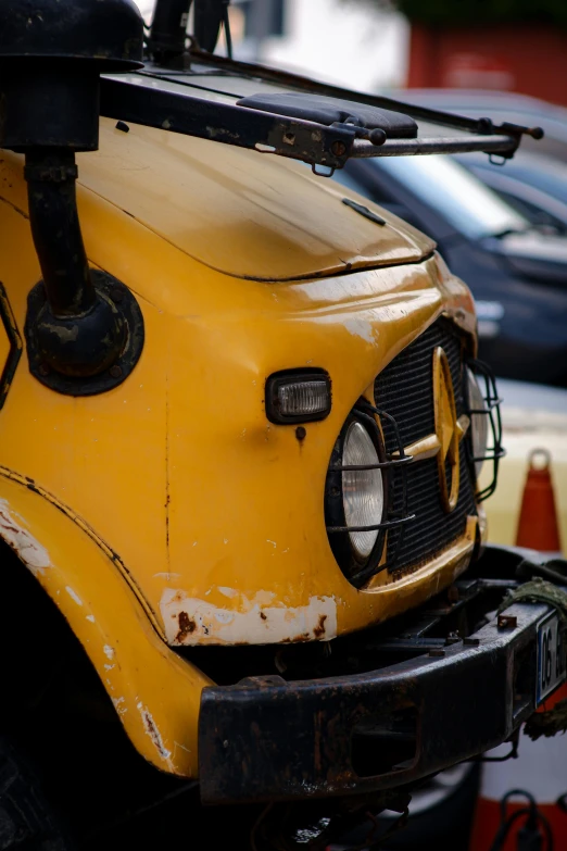 an old school bus parked with its hood open