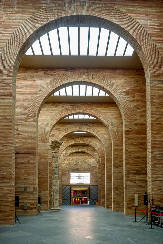 the inside of an arched building in the daytime