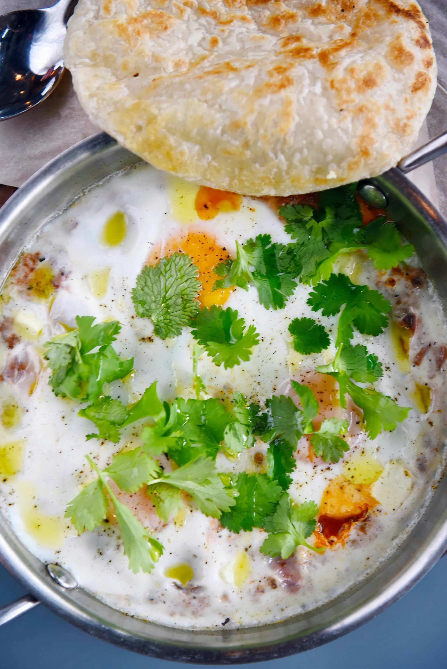 a silver pan filled with a mixture of various foods