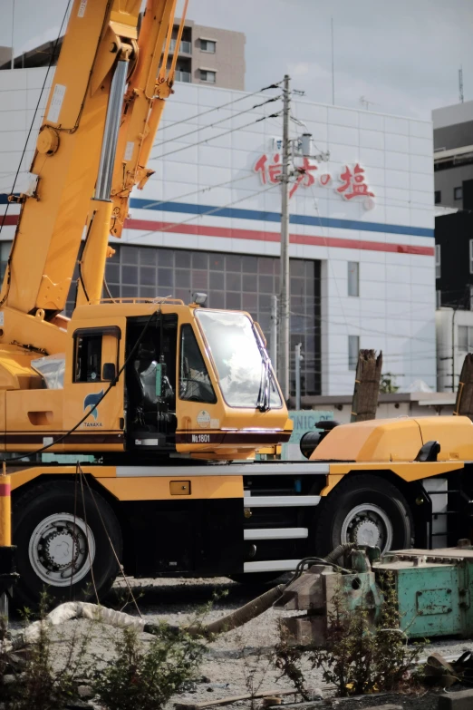 a crane is lifting soing from the ground