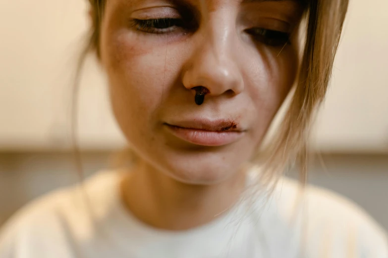 a woman with her nose pierced in half