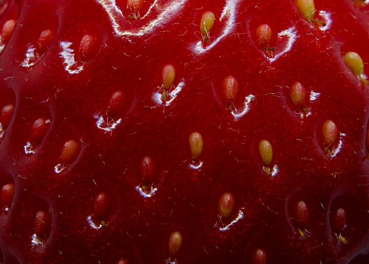 a closeup view of a red strawberry that has been sliced