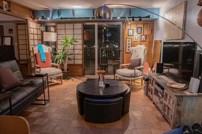 a living room filled with furniture and a flat screen tv