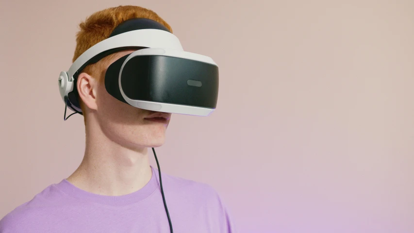 a woman using a pair of virtual headset