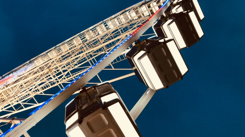 an aerial s of a ferris wheel against a blue sky