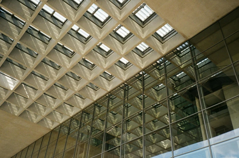 a building's interior that has many windows and a decorative structure