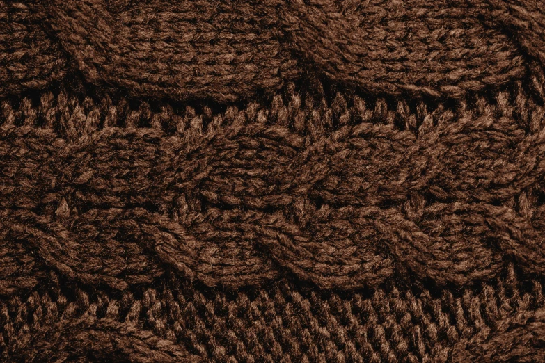 some brown knitted objects on a table