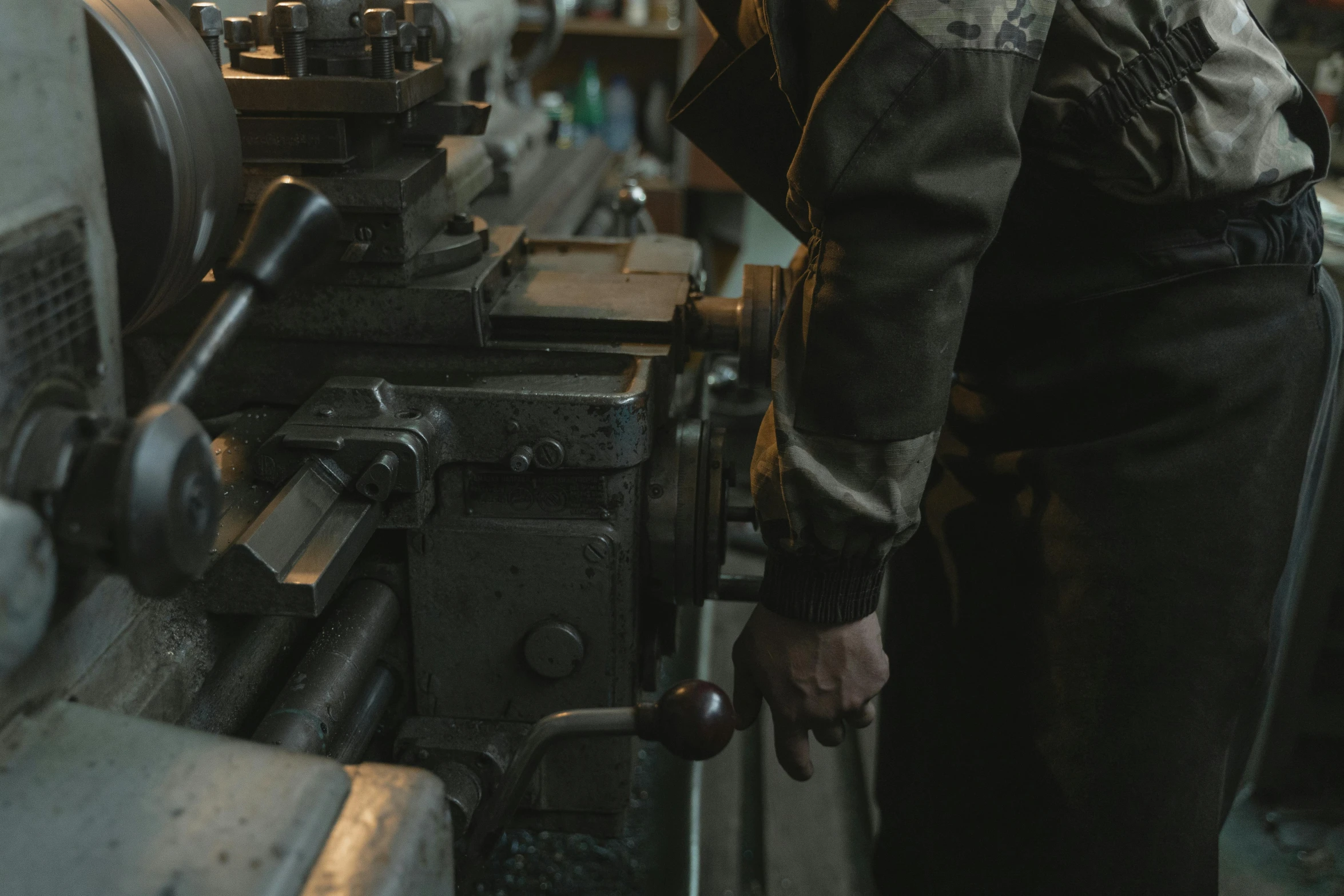 the man works in the shop and repairs the device