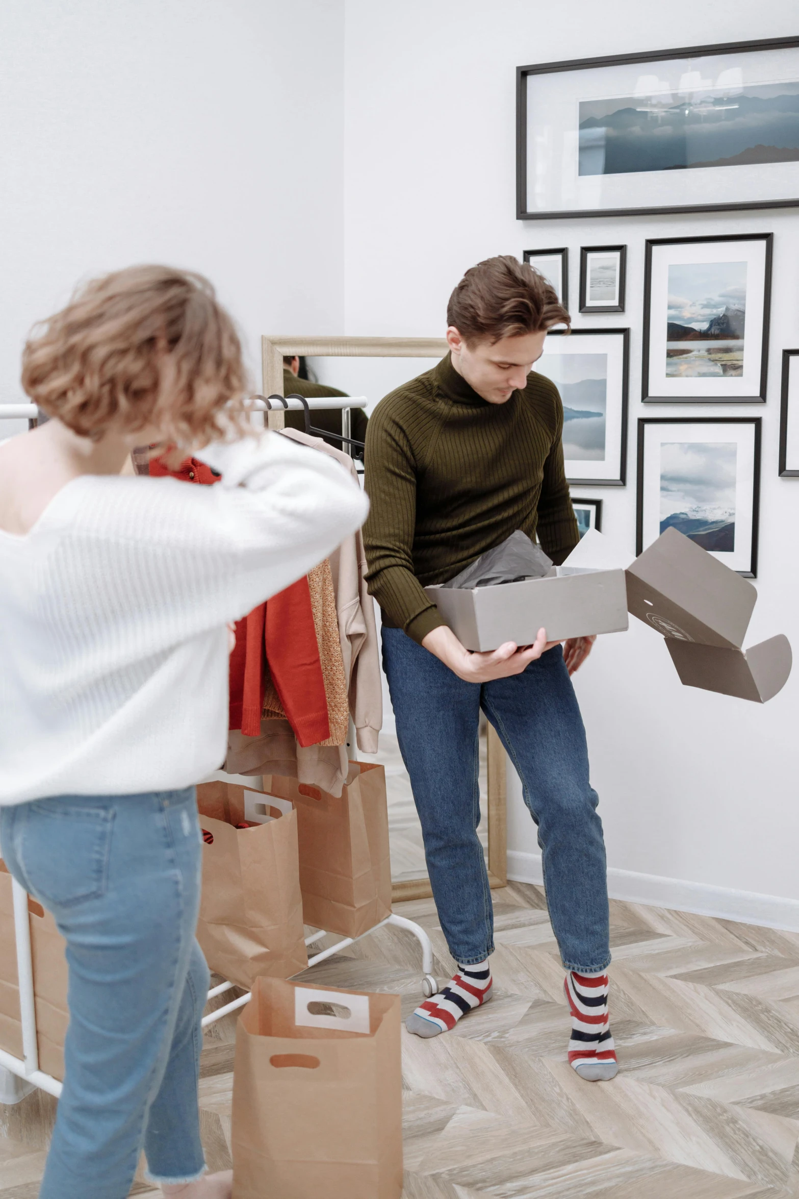 a woman puts a box into a cardboard costume