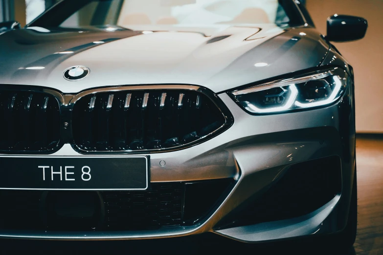 a car is parked in a showroom, which has the number 8 on it