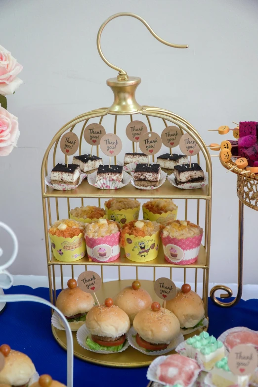 a table is filled with plates and cakes