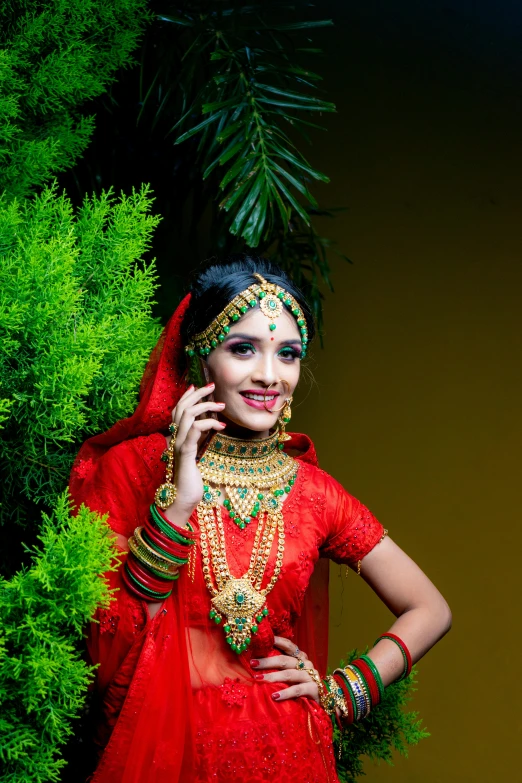 a woman in a red dress and some trees