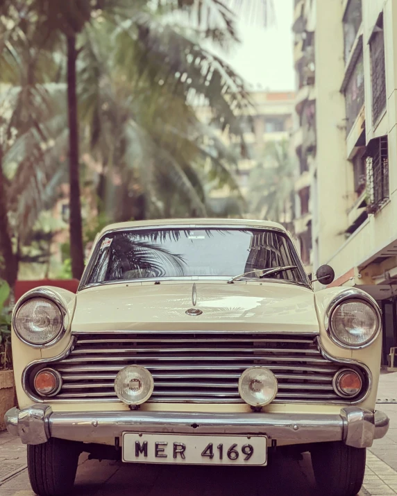 a classic american car is parked on a city street