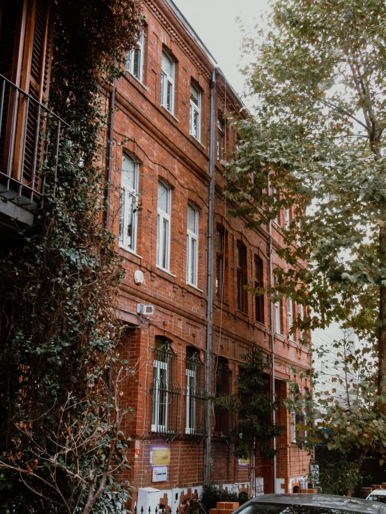 an apartment building with cars parked in front